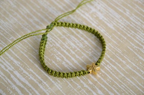 Handmade womens macrame woven bracelet of green color with charm in the shape of star - MADEheart.com