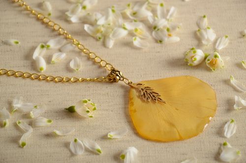 Handmade neck pendant on suede cord with flower petal coated with epoxy resin  - MADEheart.com