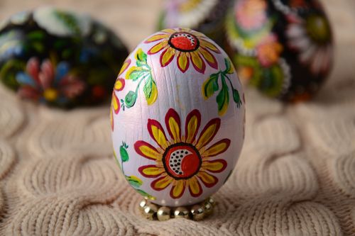 Handmade painted wooden Easter egg with bright flower son white background - MADEheart.com