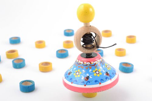 Handmade funny bright blue and pink painted wooden eco toy spinning top for kids - MADEheart.com