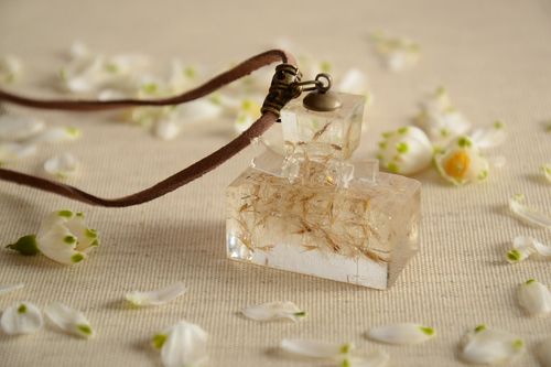 Handmade epoxy resin pendant with flowers inside in the shape of bottle on cord - MADEheart.com