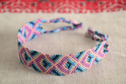 Handmade friendship wrist bracelet woven of threads with bright ornament and ties - MADEheart.com