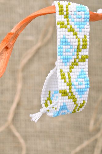 Tender light handmade wrist bracelet woven of beads with floral motives - MADEheart.com
