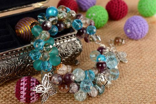 Handmade festive beautiful bracelet made of crystal and glass with charms - MADEheart.com