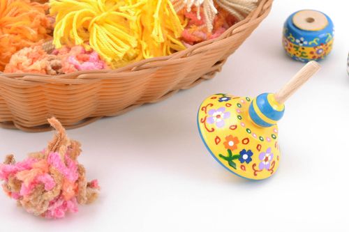 Bright yellow painted wooden spin top toy with beautiful pattern handmade  - MADEheart.com