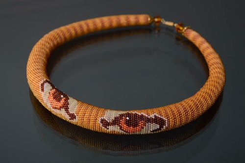 Beaded cord necklace with animal motives - MADEheart.com