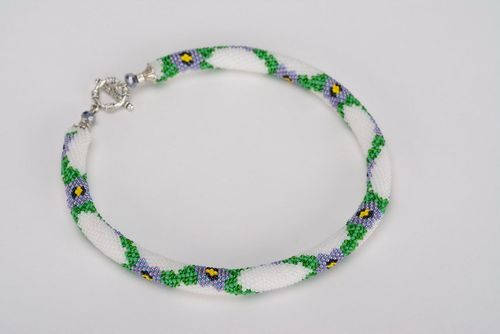 Cord necklace made of beads with floral pattern - MADEheart.com